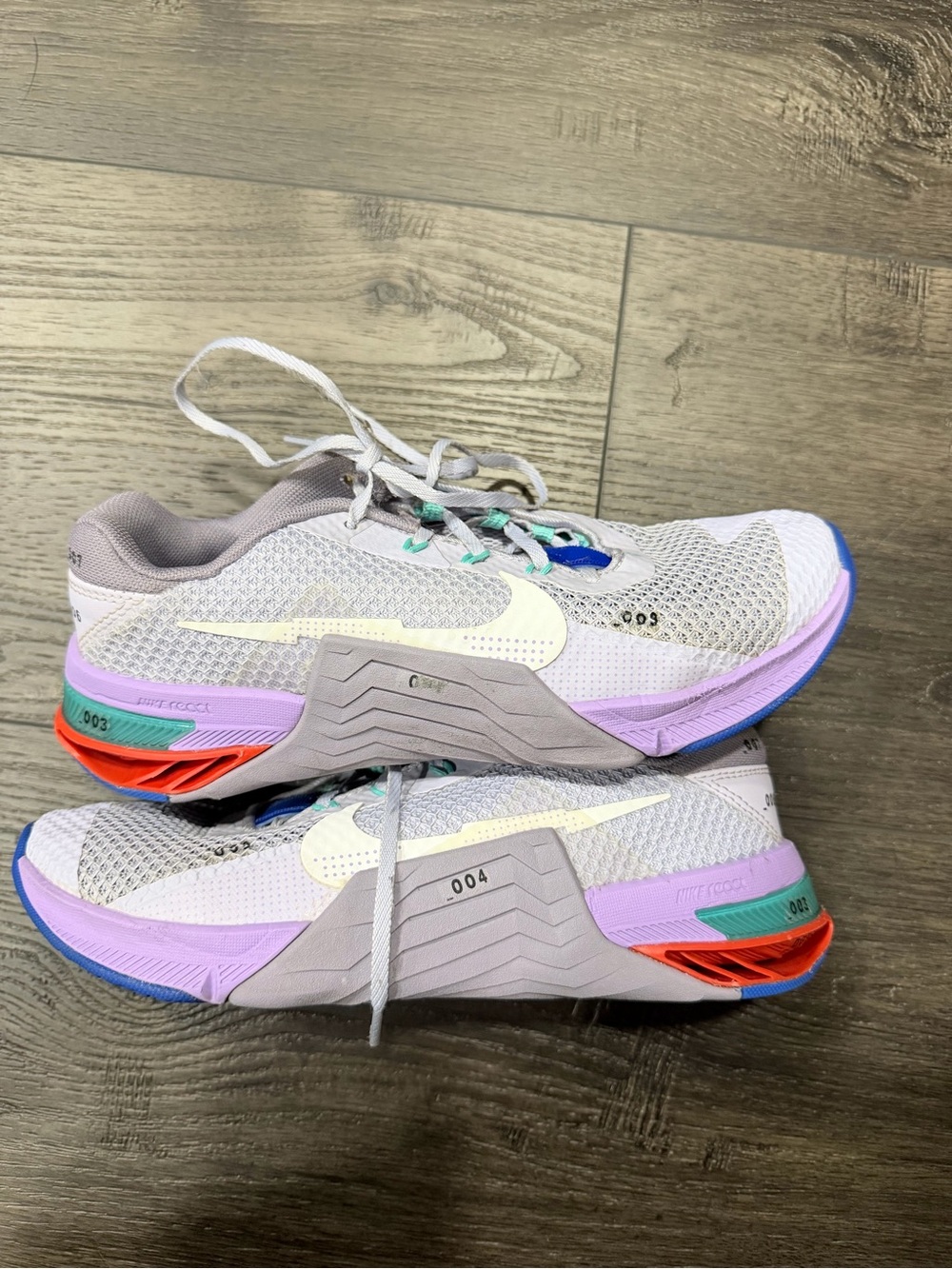 Nike Women’s White Athletic Shoes with Purple and Teal Accents